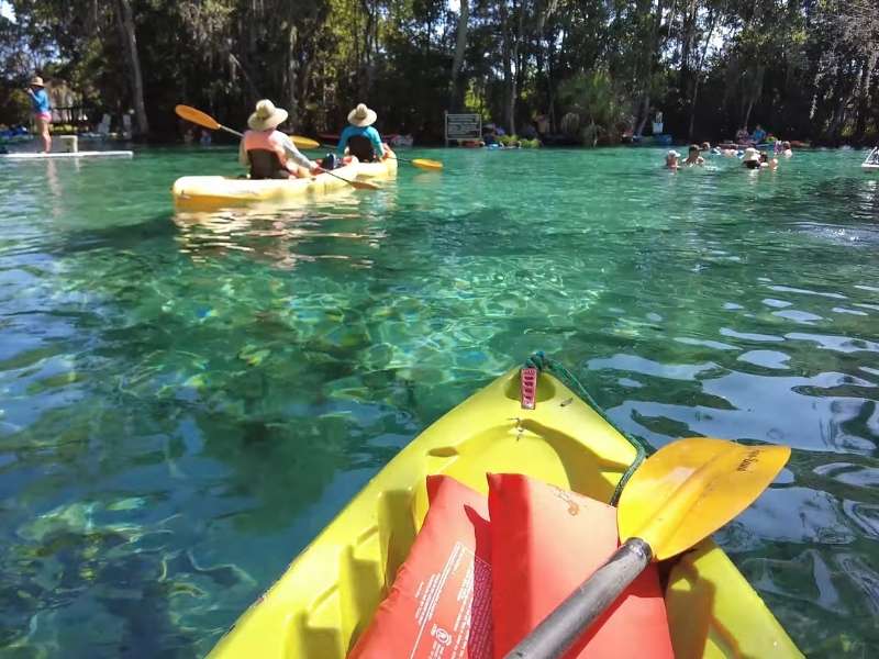 Kayaking and swimming in crystal-clear spring